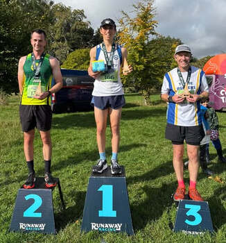 This photo is of the first three finishers for the 10K. It was taken by Thame Runners